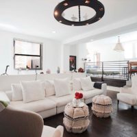 Living room interior with white ceiling and dark floor.