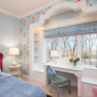 A table in front of the window in the bedroom of a private house