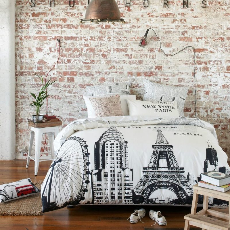 Loft bedroom with brick wallpaper