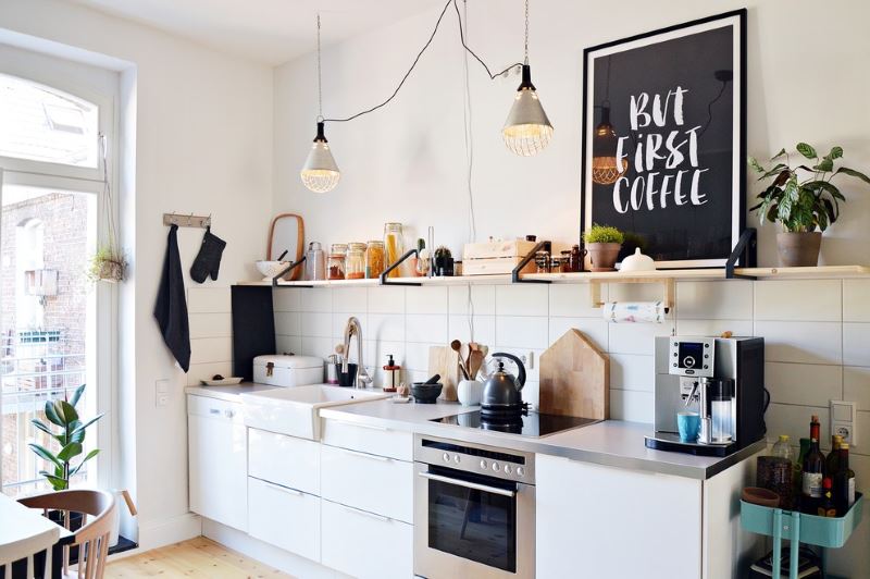 Eclectic-style kitchen design with hinged shelf on the wall