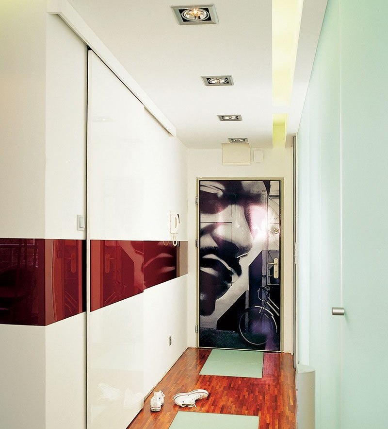 White entryway with reddish brown floor