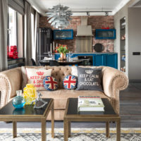 Bright decorative pillows in the interior of the industrial-style living room