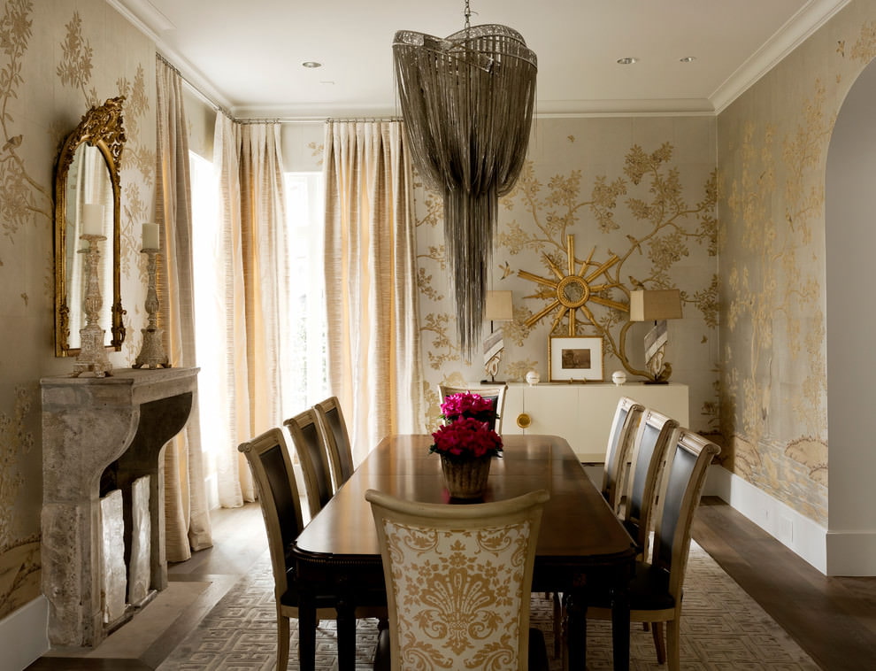 Large dining table in a room with golden wallpaper