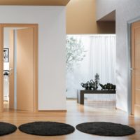 Three round rugs in black