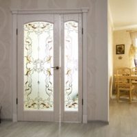 Wooden double-wing door with stained-glass windows