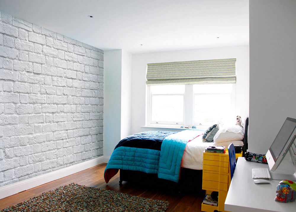 Bright bedspread in a bedroom with white walls