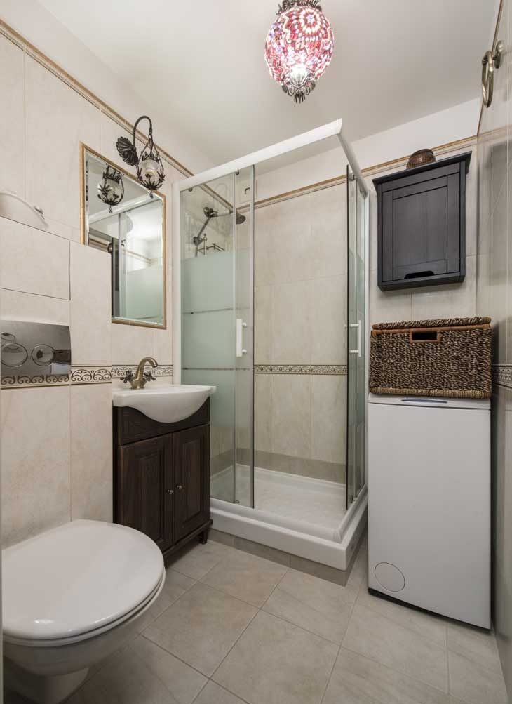 Interior of a small bathroom with shower