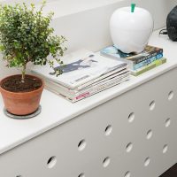 Radiator screen with round holes