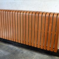 Screen from laminated strips on a heating radiator