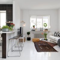 Colorful carpet on the white floor of the living room