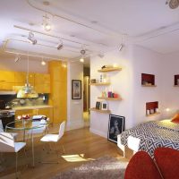 Yellow kitchen with glossy facades