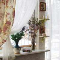 Vases with wildflowers on a windowsill