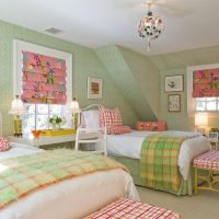 Nursery for a girl with green wallpaper