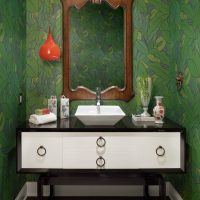 Mirror in a wooden frame above the washbasin