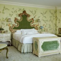 Classic bedroom interior with green wallpaper