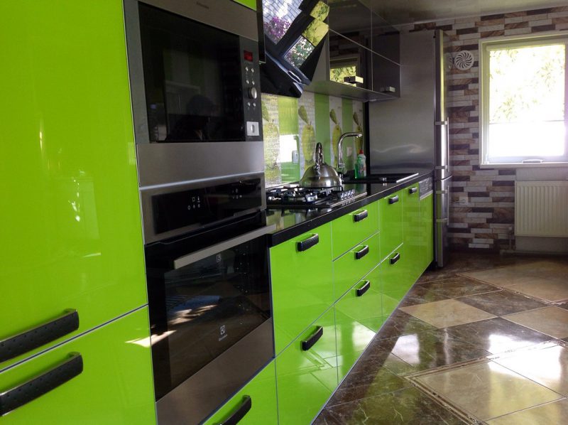 The glossy surface of the ceramic floor in the kitchen of a panel house