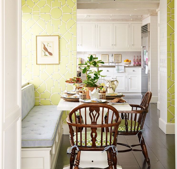 Green wallpaper with geometric patterns on the walls of the kitchen