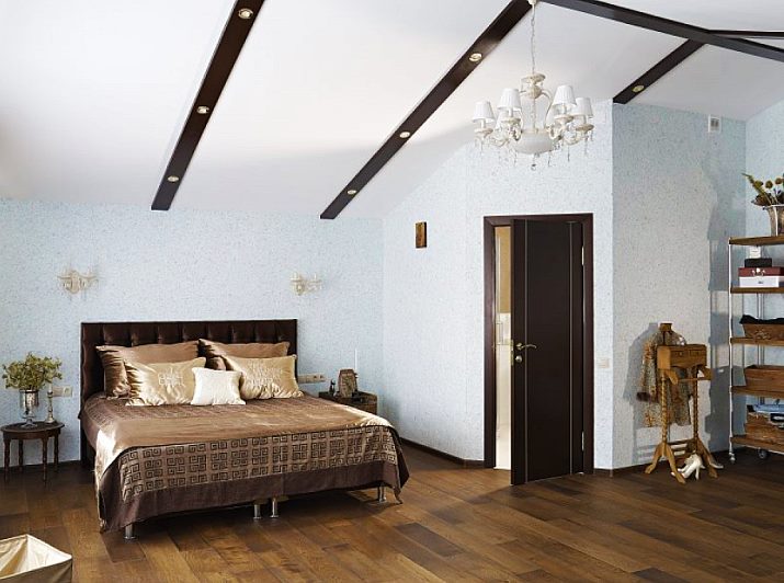 Bright walls of the attic bedroom of a private house