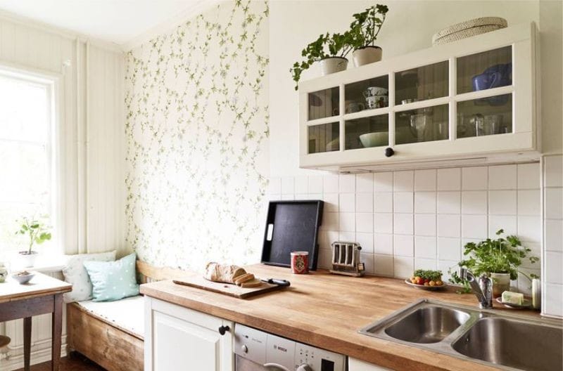 Design of a small kitchen with a splash of green