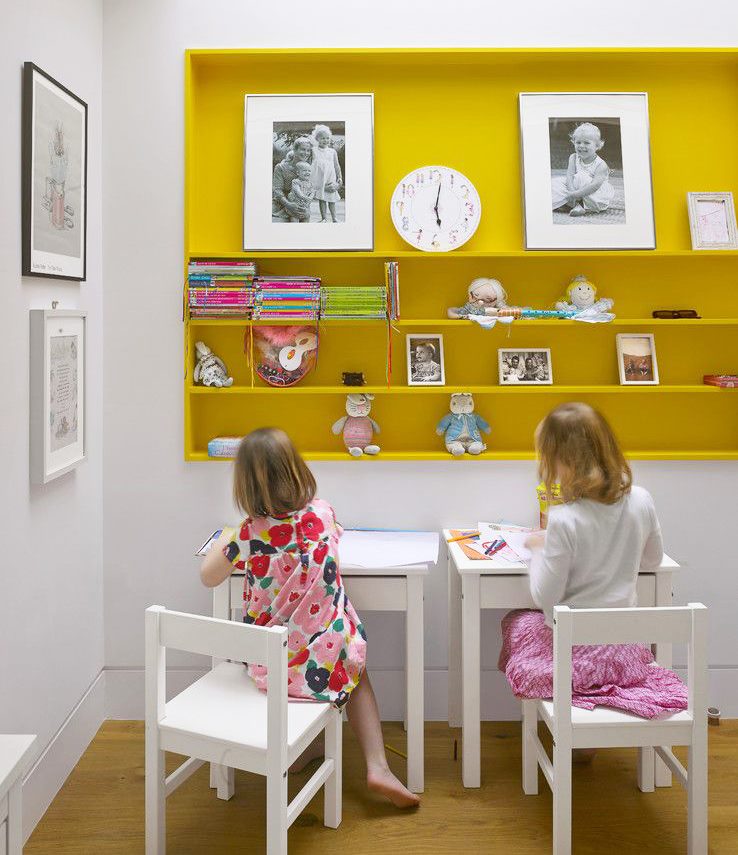 Yellow shelf in the interior of a children's room