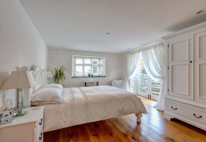 Bright bedroom with tulle curtains