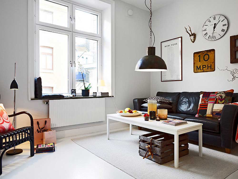 Clock with roman numerals on a white wall of the living room