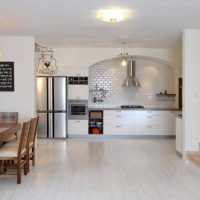 White laminate in the kitchen-living room