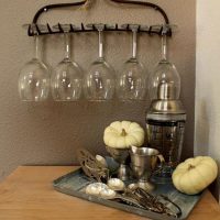 Old rake as a holder for wine glasses