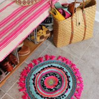 Colorful knitted rug on ceramic floor