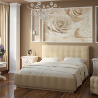 Wall mural with big roses over the bed for a girl