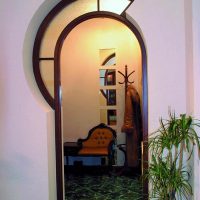 Original arch with stained glass at the top of the opening