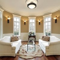 Sofa zone in the bay window of a private house