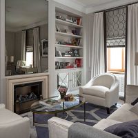 Large mirror above the fireplace in the living room