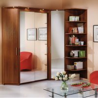 Reflection of a red chair in the mirrored cabinet doors