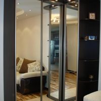 Black cupboard on a bright floor