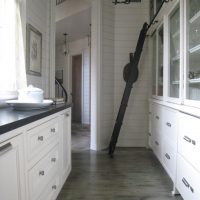 Kitchen with high cupboards in a private house