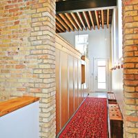 Colorful carpet on the floor of a narrow hallway