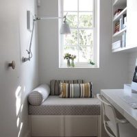 A narrow window above the children's sofa