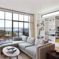 Panoramic window in the living room of a multi-storey building