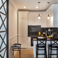 Black apron in the kitchen with a white set