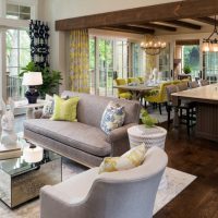 The interior of a large living room in a rustic house