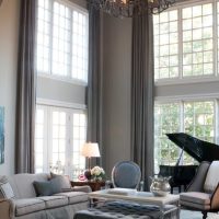 Gray curtains on the tall windows of the living room