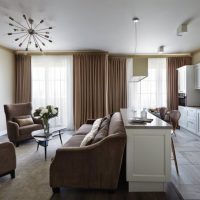 Brown curtains on the windows of the kitchen-living room