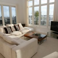 Corner sofa in a bright room of a panel house