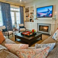 Large TV over the fireplace in the living room