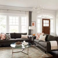 Dark gray sofas in a white room