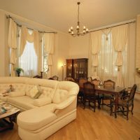 Chandelier with open bulbs on the living room ceiling