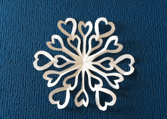 White snowflake made of plain paper