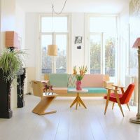 Narrow tall windows in a white living room