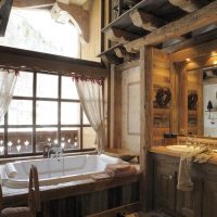 Acrylic bathtub in front of a window in a country house